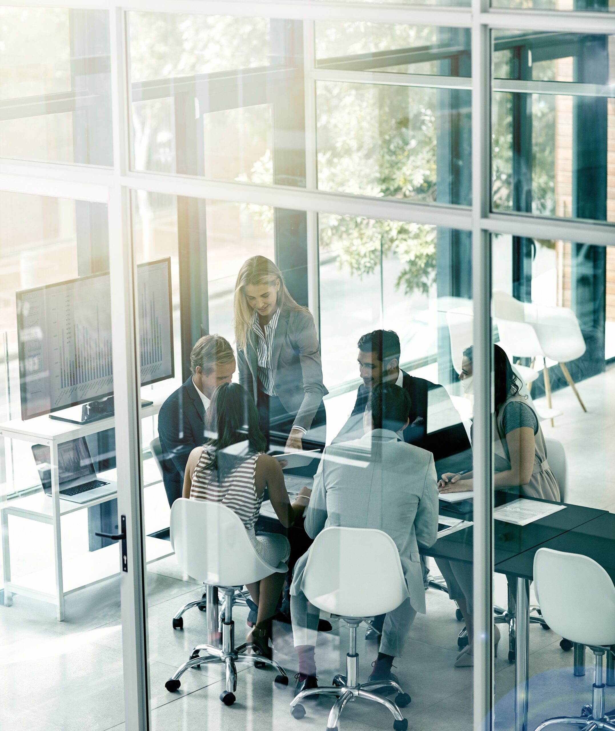 Business owners meeting in boardroom to discuss important matters