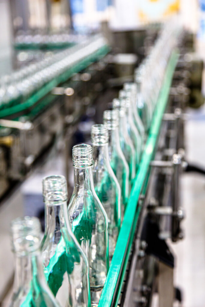 Conveyor belt of vodka bottles in a factory